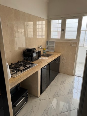 location-dun-appartement-a-agdal-surface-totale-85-m2-salon-contemporain-big-1