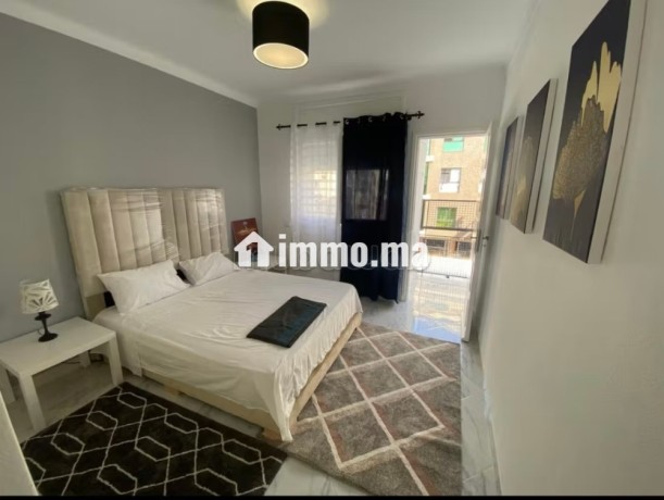 location-dun-appartement-a-agdal-surface-totale-85-m2-salon-contemporain-big-6