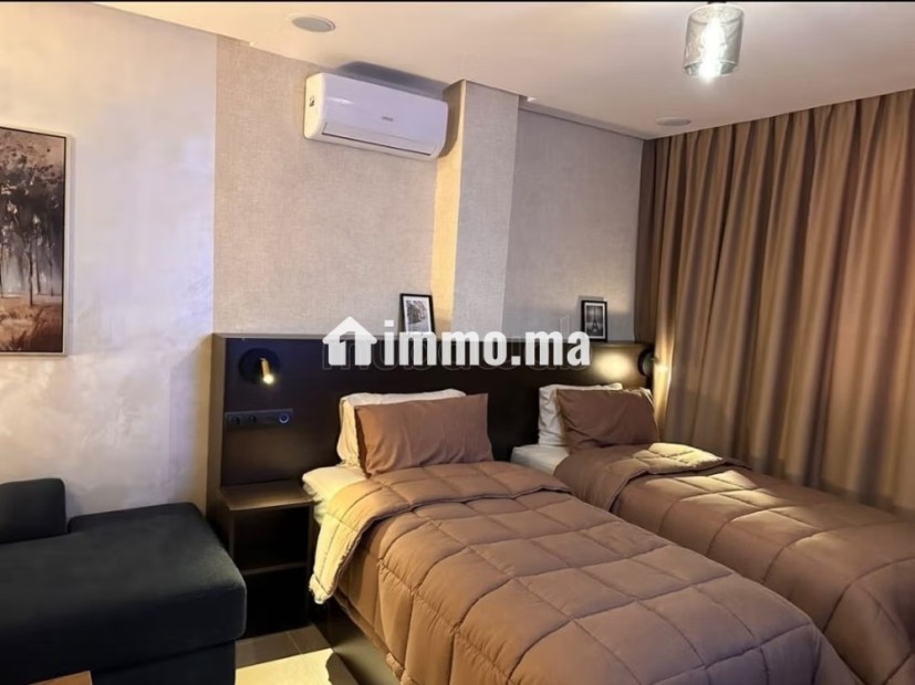 Appartement à louer à Hay Mohammadi. 2 chambres agréables. Salon contemporain - Location Immobilier - Agadir - photo 8