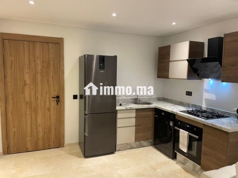 Appartement en vente à Camp Al Ghoul.
Surface de 58 m².
Meublé - Vente Immobilier - Marrakech - photo 4