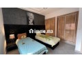 location-dun-appartement-a-saidia-surface-de-85-m2-salon-contemporain-small-1