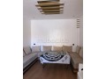 location-dun-appartement-a-saidia-surface-de-85-m2-salon-contemporain-small-3
