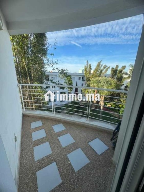 Appartement dans une résidence avec jardin a Riad - Location Immobilier - Rabat - photo 5
