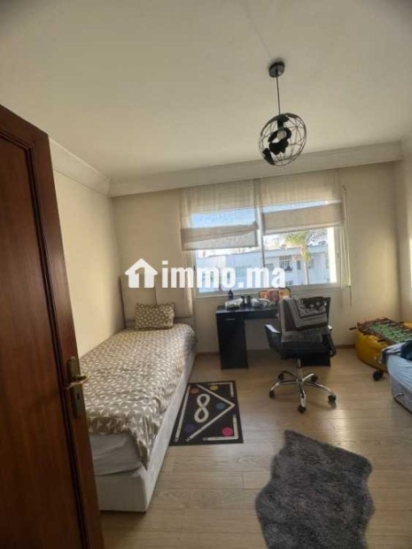 Appartement dans une résidence avec jardin a Riad - Location Immobilier - Rabat - photo 8
