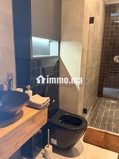 Louez cet appartement à Palmier. Superficie 54 m². Porte sécurisée et chauffage central - Location Immobilier - Casablanca - photo 8