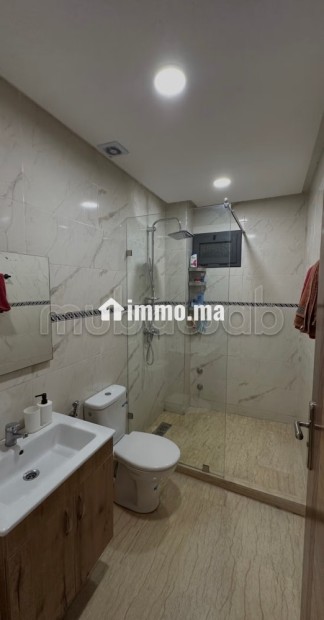 Location d'un appartement à Aïn Sebaâ. 3 pièces confortables. Ascenseur et stationnement - Vente Immobilier - Casablanca - photo 4