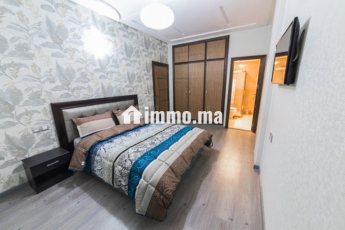 location-dun-appartement-a-agdal-4-pieces-terrasse-et-ascenseur-big-3
