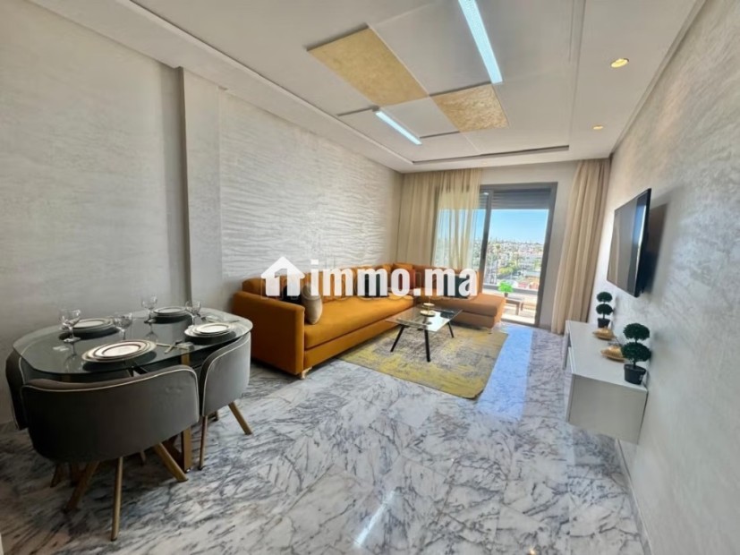 Location d'un appartement à Casablanca Finance City.
Surface de 100 m².
Antenne parabolique et sécurité - Vente Immobilier - Casablanca - photo 1